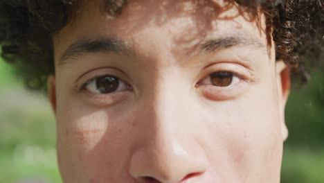 Close-up-of-portrait-of-happy-biracial-man-on-sunny-day-at-wedding