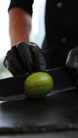 chef cutting a lime