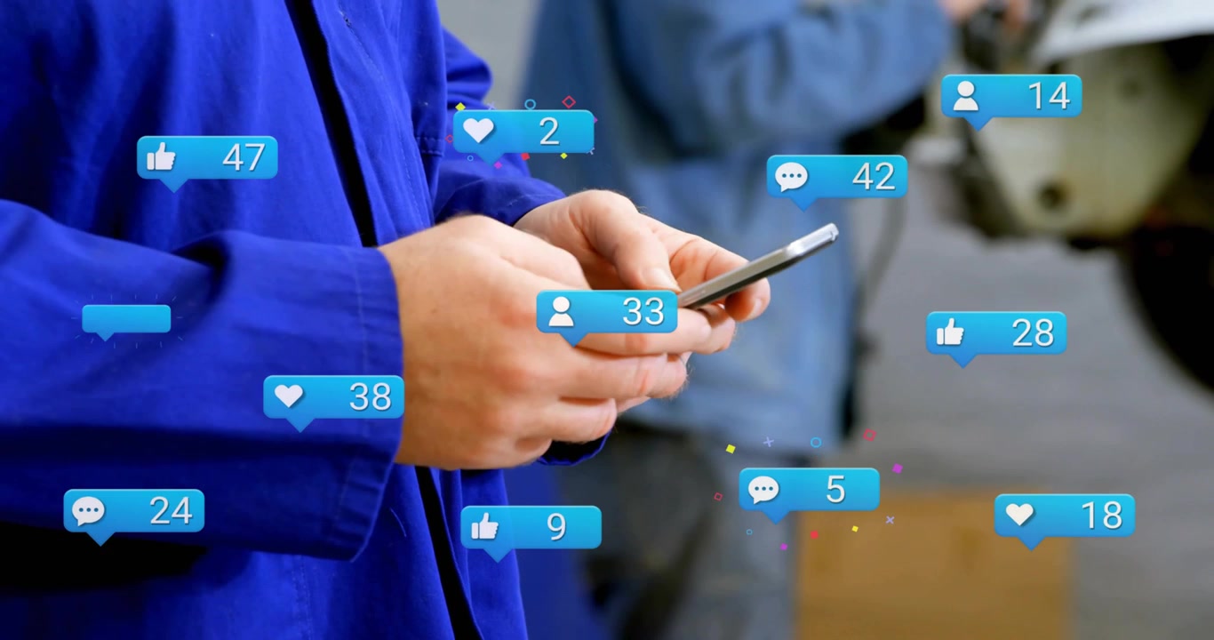 Technician tapping smartphone at workbench seeing social media icons rising and boosting engagement