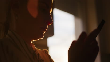 Silhouette-of-Woman-Scrolling-Smartphone-Browsing-Social-Media