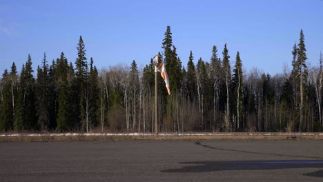 a broken windbag on runway of fort st