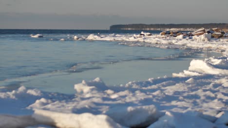 In-the-winter,-stones-are-icy-on-the-sea-shore