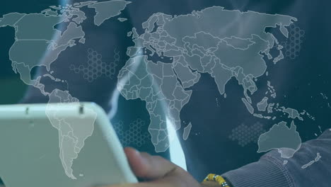 animation of world map over african american man using tablet