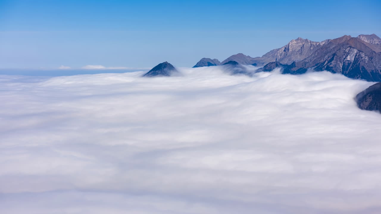 Time Lapse of Majestic Clouds Flowing Over Mountain Peaks