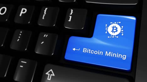 bitcoin mining key on computer keyboard