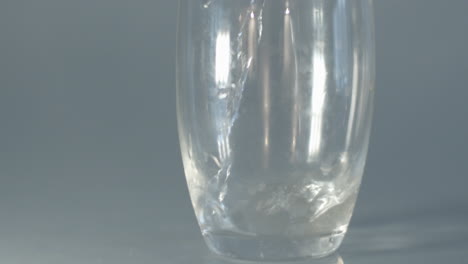 water being poured into glass in slow motion