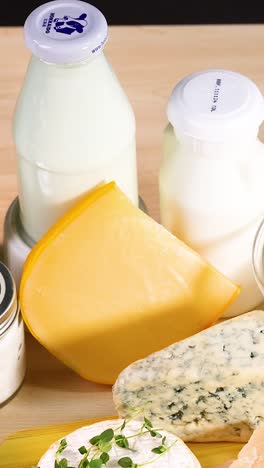 assorted dairy products on a wooden background