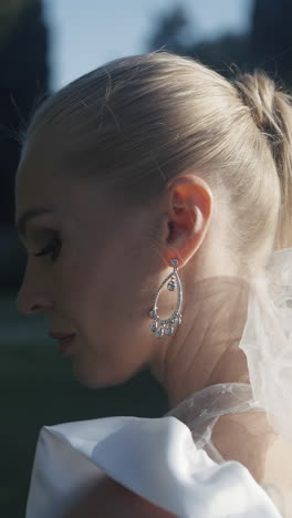 close-up of a bride wearing earrings