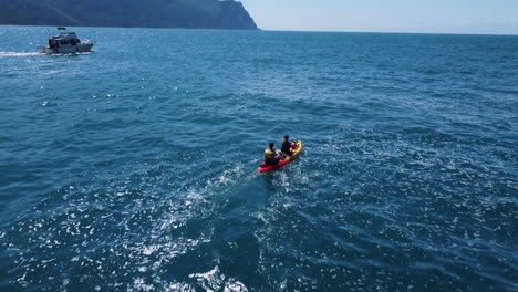 kayaking on the ocean with a boat in the background