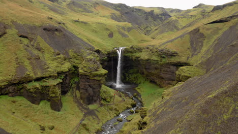 Aerial:-Panoramic-shot-of-spectacular-Kvernufoss-waterfall-in-South-Iceland