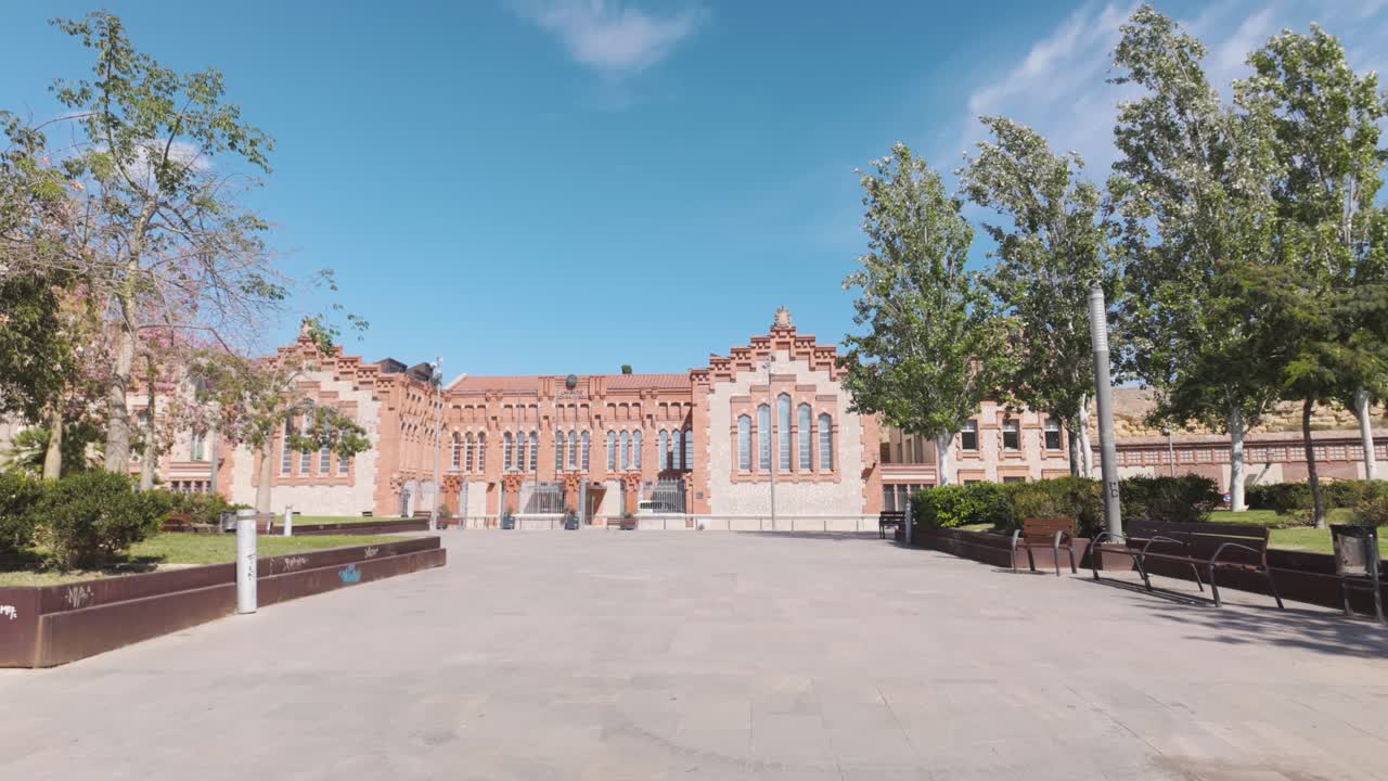 Wide shot of the University of Rovira i Virgili in Tarragona, Spain, highlighting the architectural design of the building on a clear sunny day