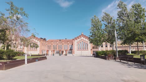 wide shot of the university of rovira i virgili in tarragona, spain, highlighting the architectural design of the building on a clear sunny day