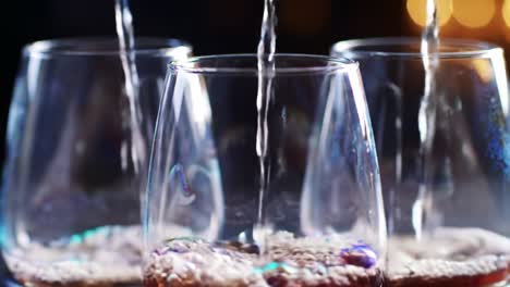 pouring drinks into glasses