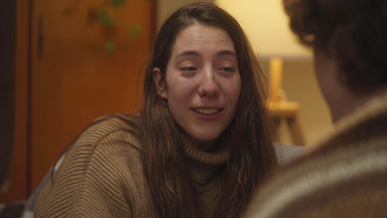 Woman in sweater indoors