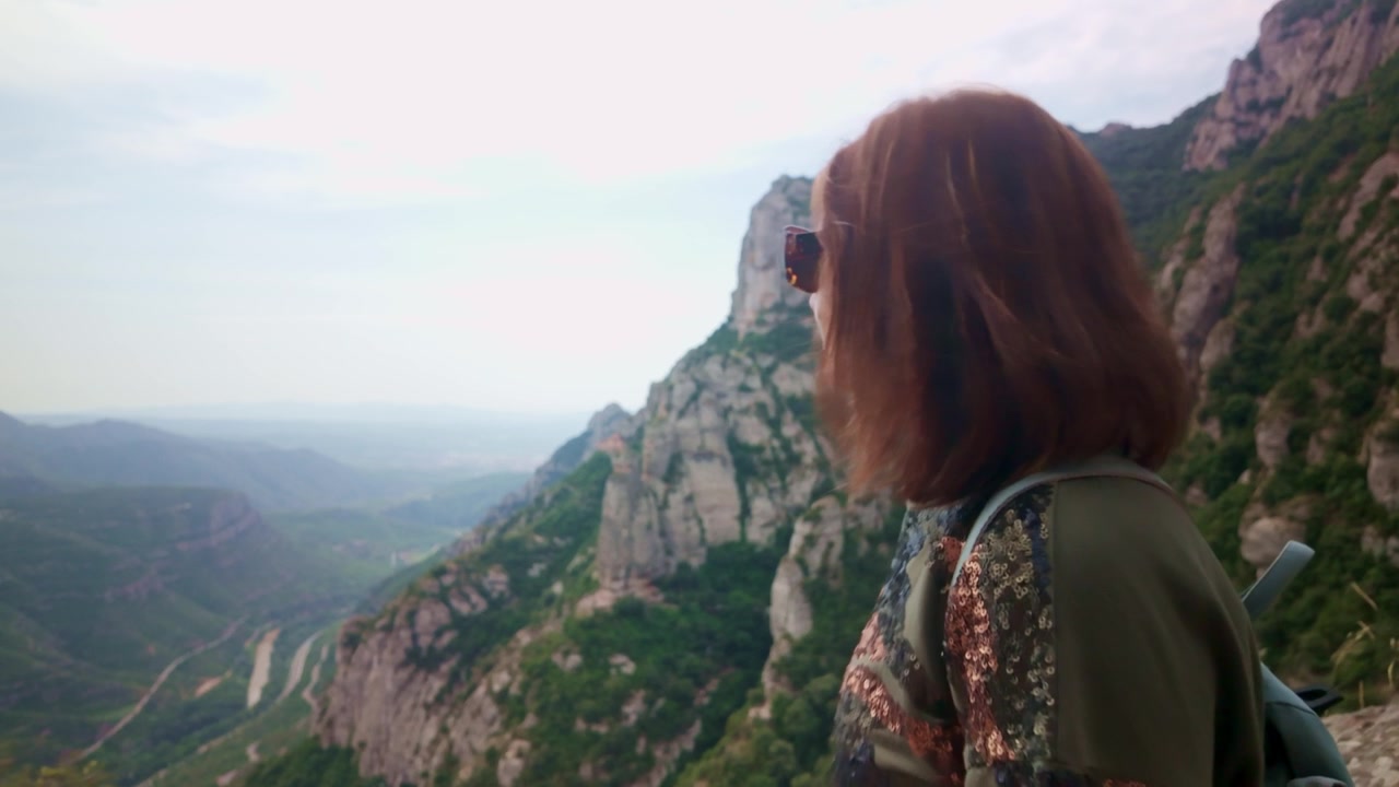 Woman admiring Montserrat mountain panoramic view