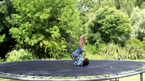 Cute-boy-playing-and-jumping-on-the-trampoline-