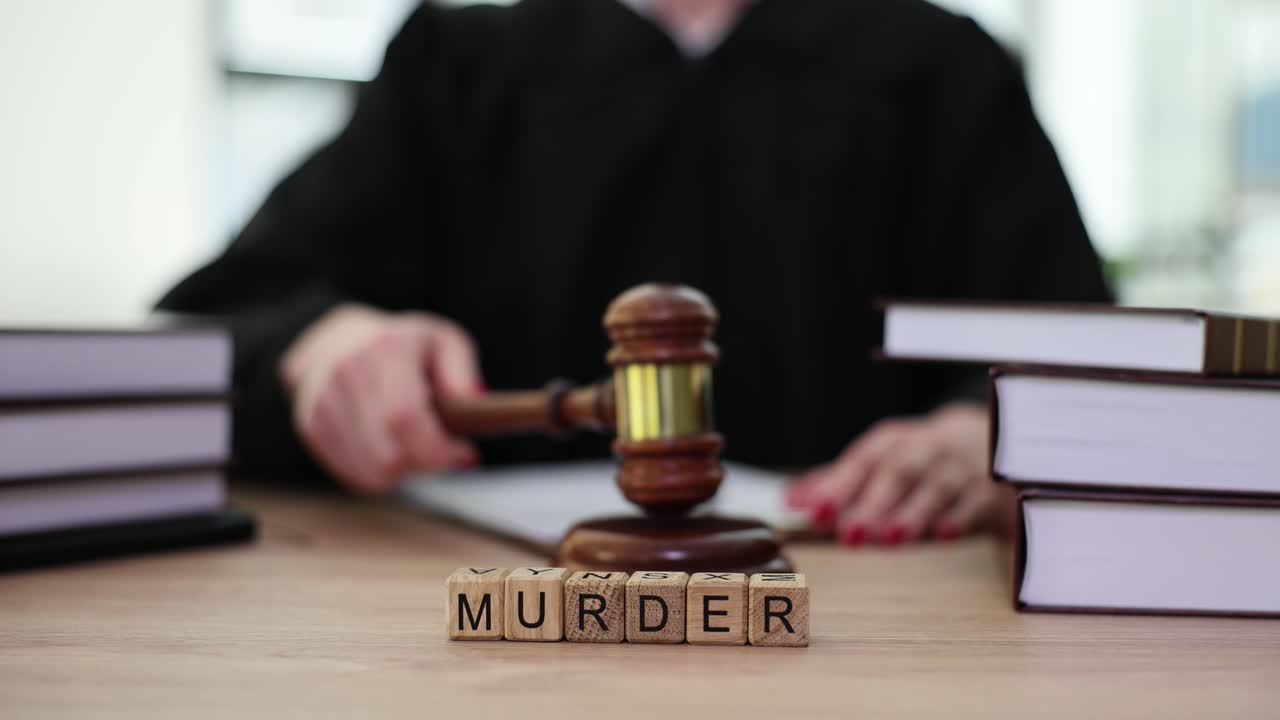 Gavel and "Murder" Blocks on Desk