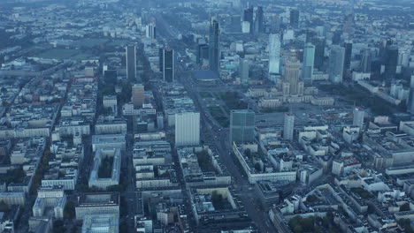 High-angle-view-of-cityscape-in-morning.-Tilt-up-reveal-of-high-rise-office-downtown-buildings-before-sunrise.-Warsaw,-Poland