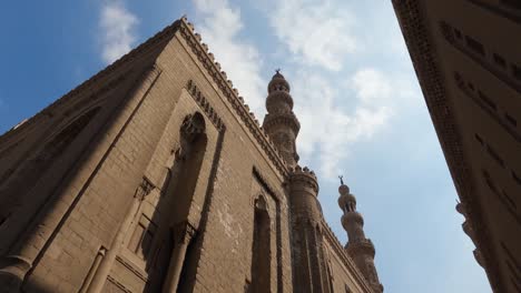 external view of mosque madrasa of sultan hassan and its soaring towers cairo, egypt. low angle