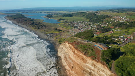 Aerial-landscape-showing-the-coast-line-in-Puerto-Saavedra,-Araucania,-Chile,-bright-sunny-day