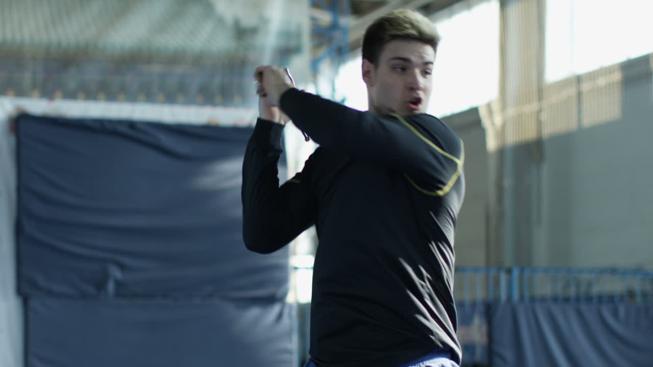 Man practicing Kendo in an indoor arena