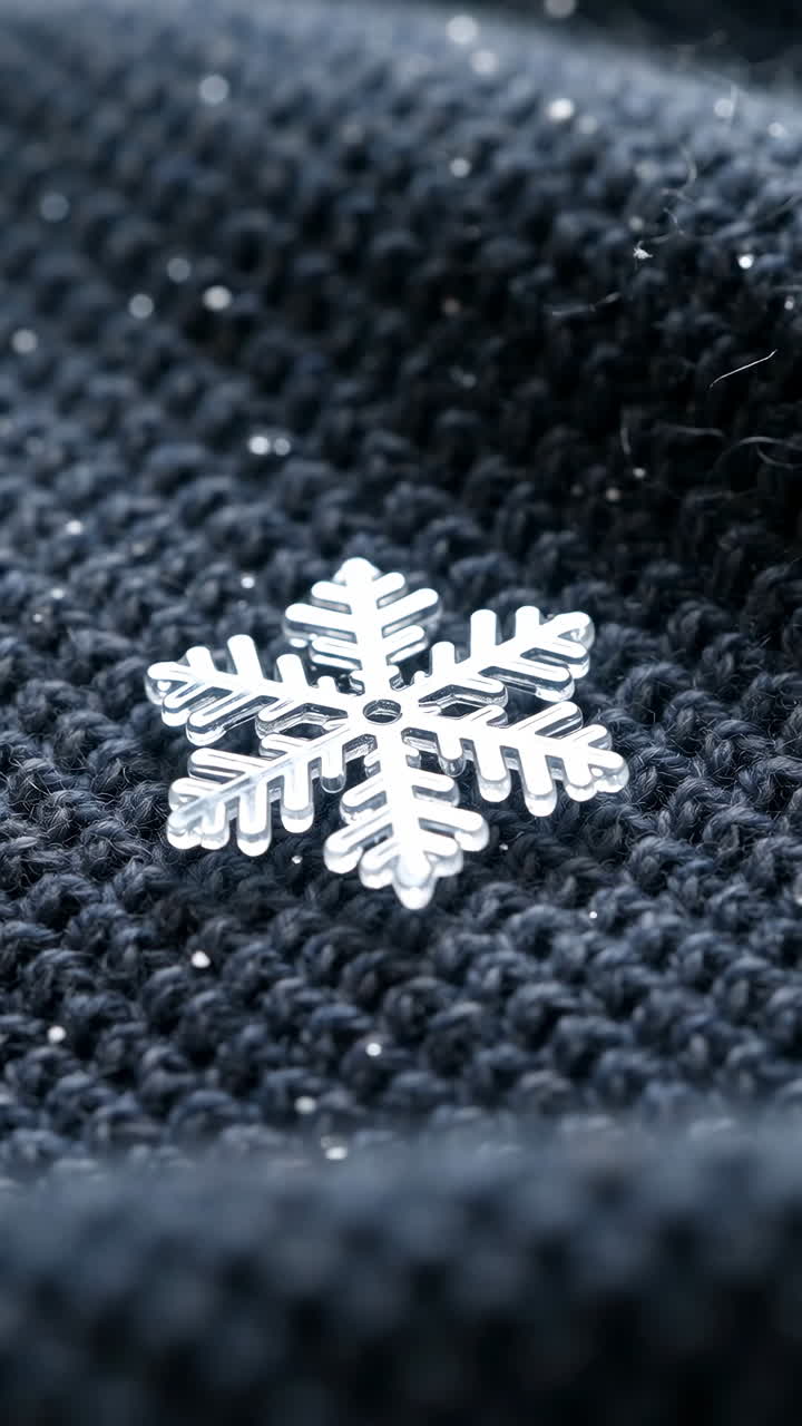 Silver Snowflake Decoration on Dark Knitted Fabric
