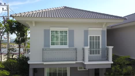 aerial footage of white and gray modern comtemporary house