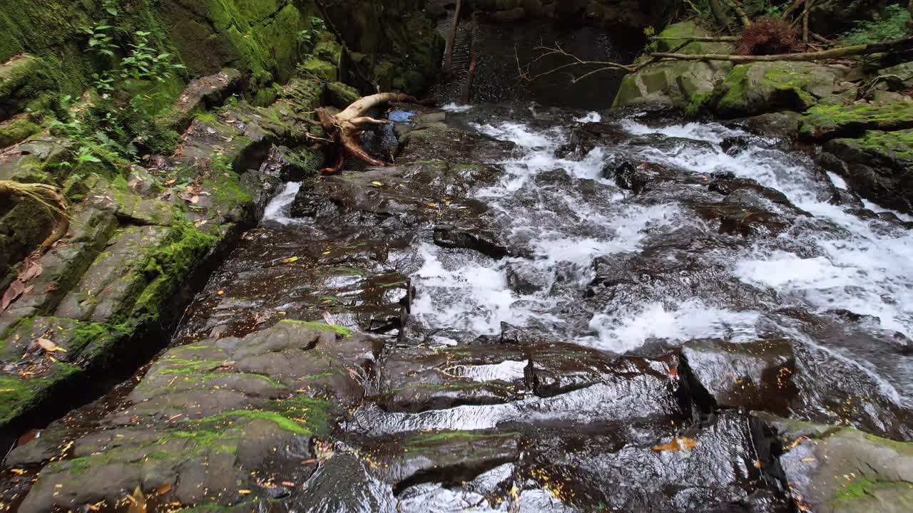 drone shot of lost waterfall, moving down towards the fall, Mahe Seychelles