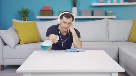 house cleaning man is thoughtful and depressed.