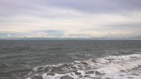 tripod-shot-of-waves-coming-in-and-out-on-an-overcast-day