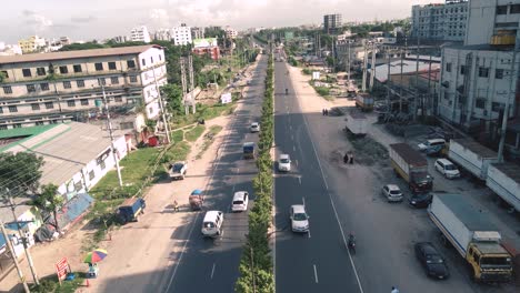 aerial shot of a busy road where vehicles are passing in dhaka, bangladesh