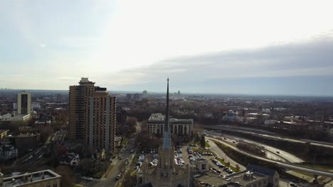 aerial view of minneapolis church surrounded by highways and cars passing by