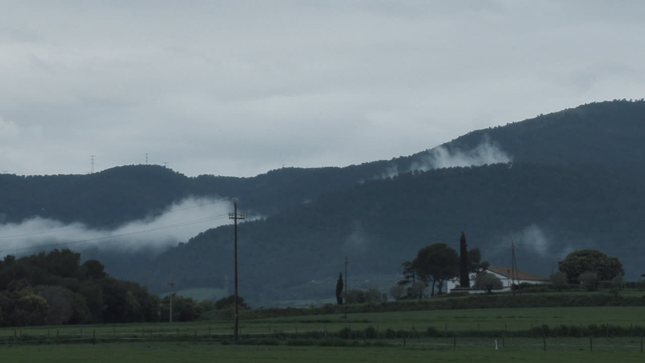 Timelapse zoom in of the movement of clouds after a storm in a small Catalan town