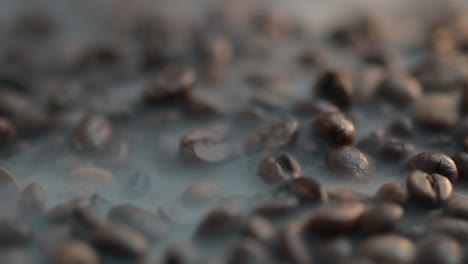 macro of a smoke rises above the coffee bean