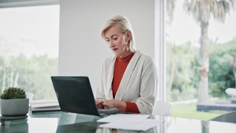 smiling senior woman working from home