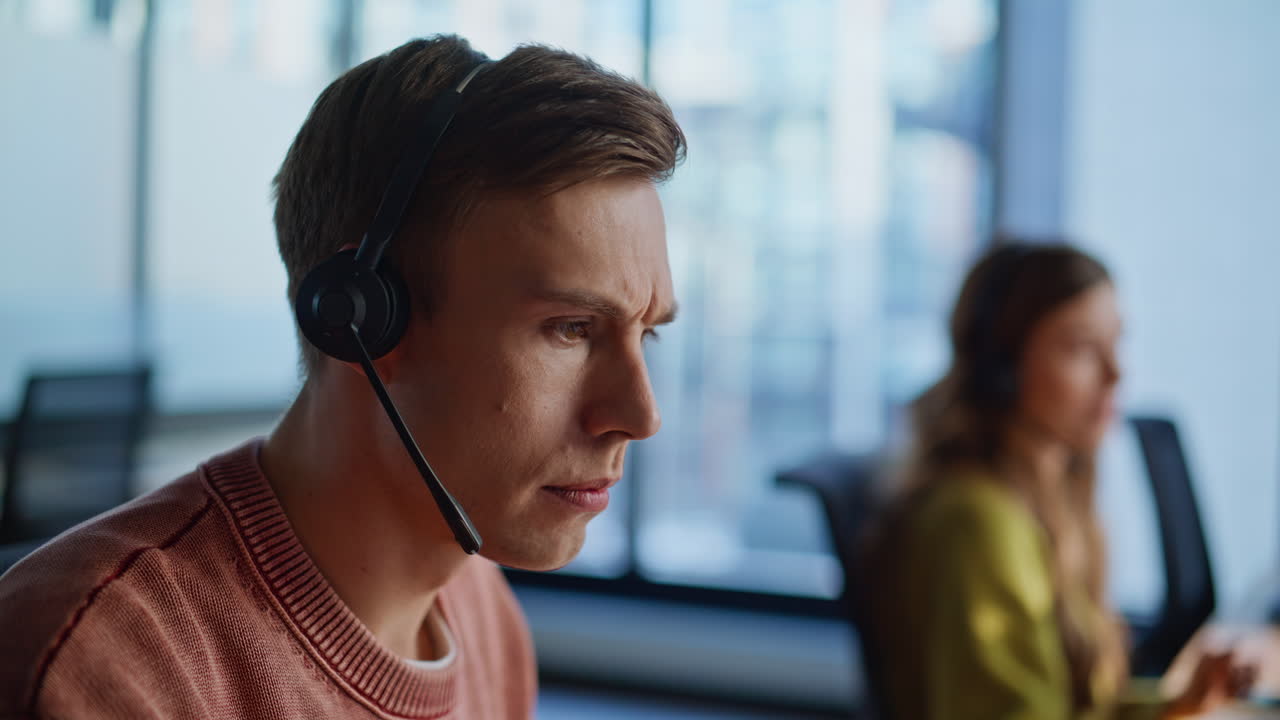 Closeup technical assistant talking in call center. Man resolve request online