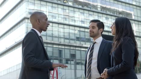 professional young business people meeting on street