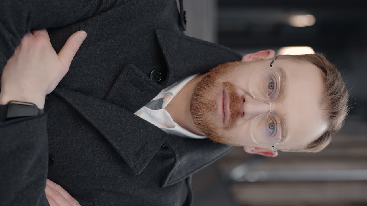 Portrait of a Man in Coat and Glasses