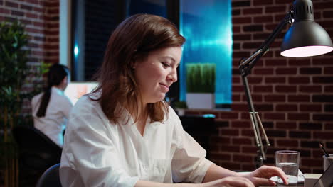 Close-up-of-smiling-businesswoman-working-for-company-project