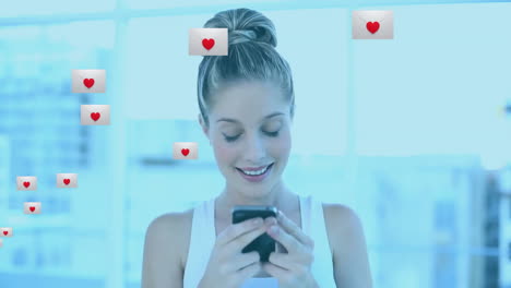 smiling woman using smartphone with heart icons animation over her