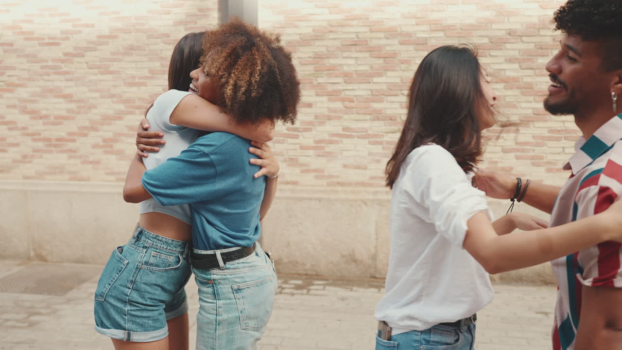 Friends Laughing and Hugging on the Street