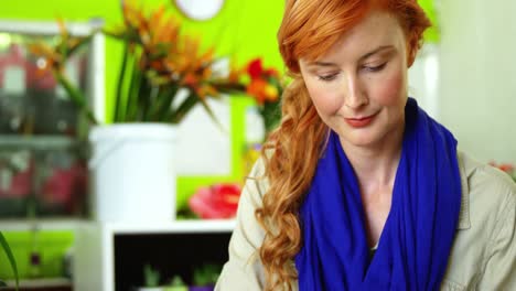 female florist cutting flower stem