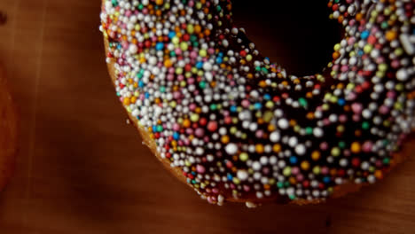 close-up of tasty doughnuts with sprinkles