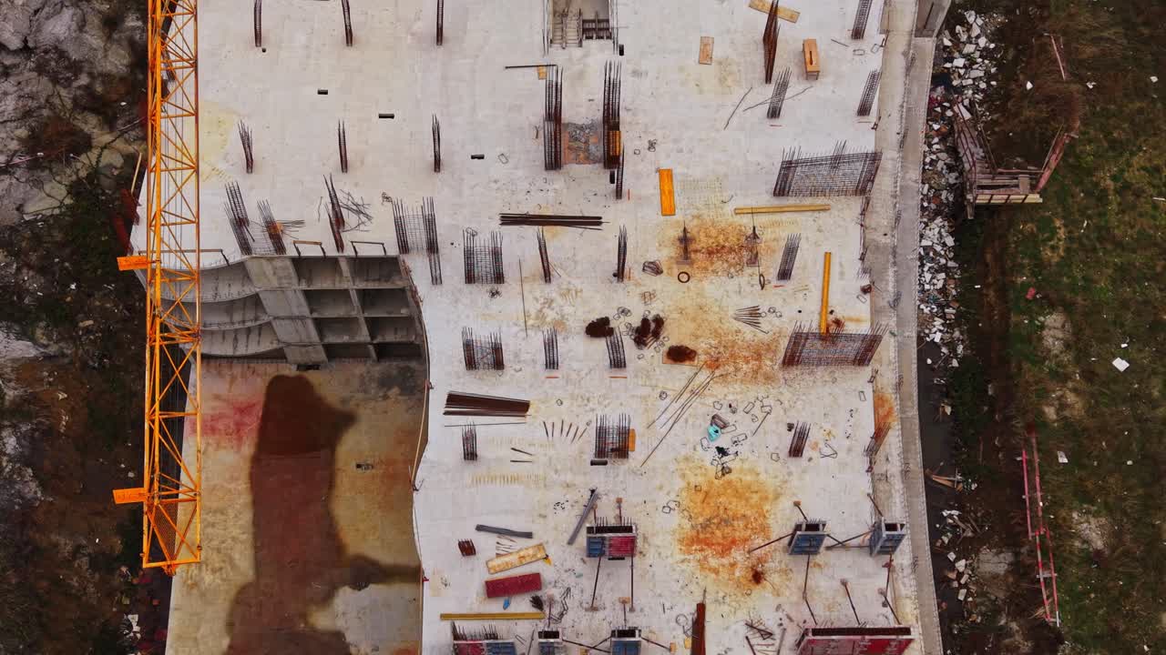 Construction site showing scaffolding and materials from above