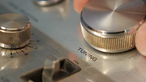 tuning fm radio stations on receiver dial close-up 4k