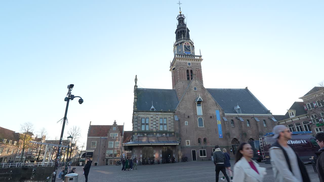 Panning view of the Waagplein including ,the Weighhouse with tower, Alkmaar city center.