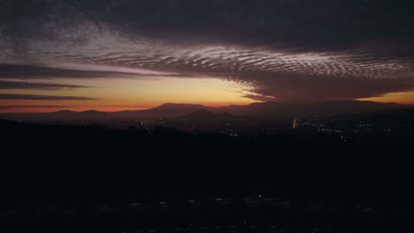 sunset drone fly santiago de chile dusk andean mist gold gradient violet skyline