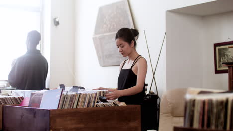 asian woman in a music store