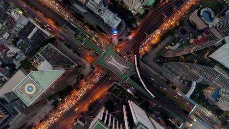 fly up, zoom out from business center of bangkok, thailand