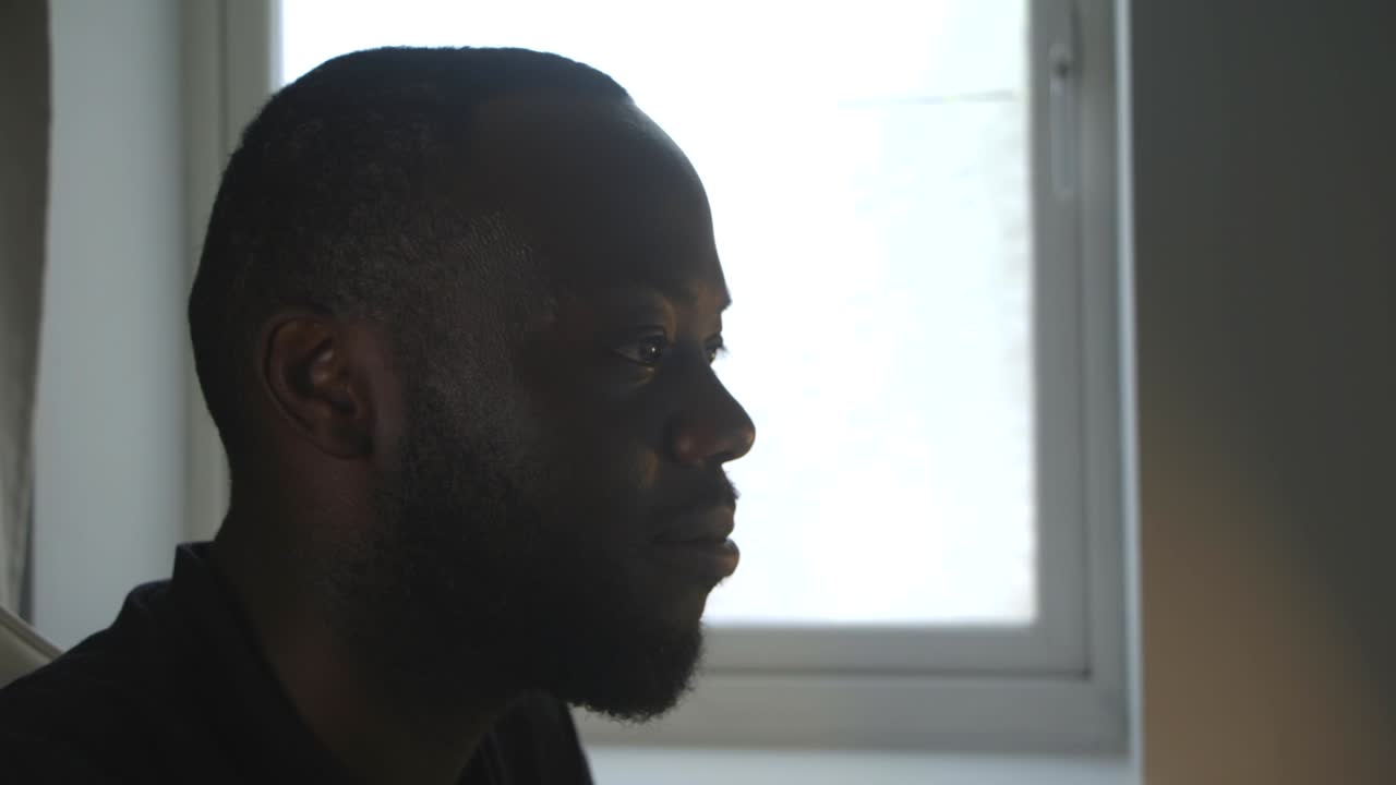 Black Male Singing To Lyrics At Computer Desk In Home Office
